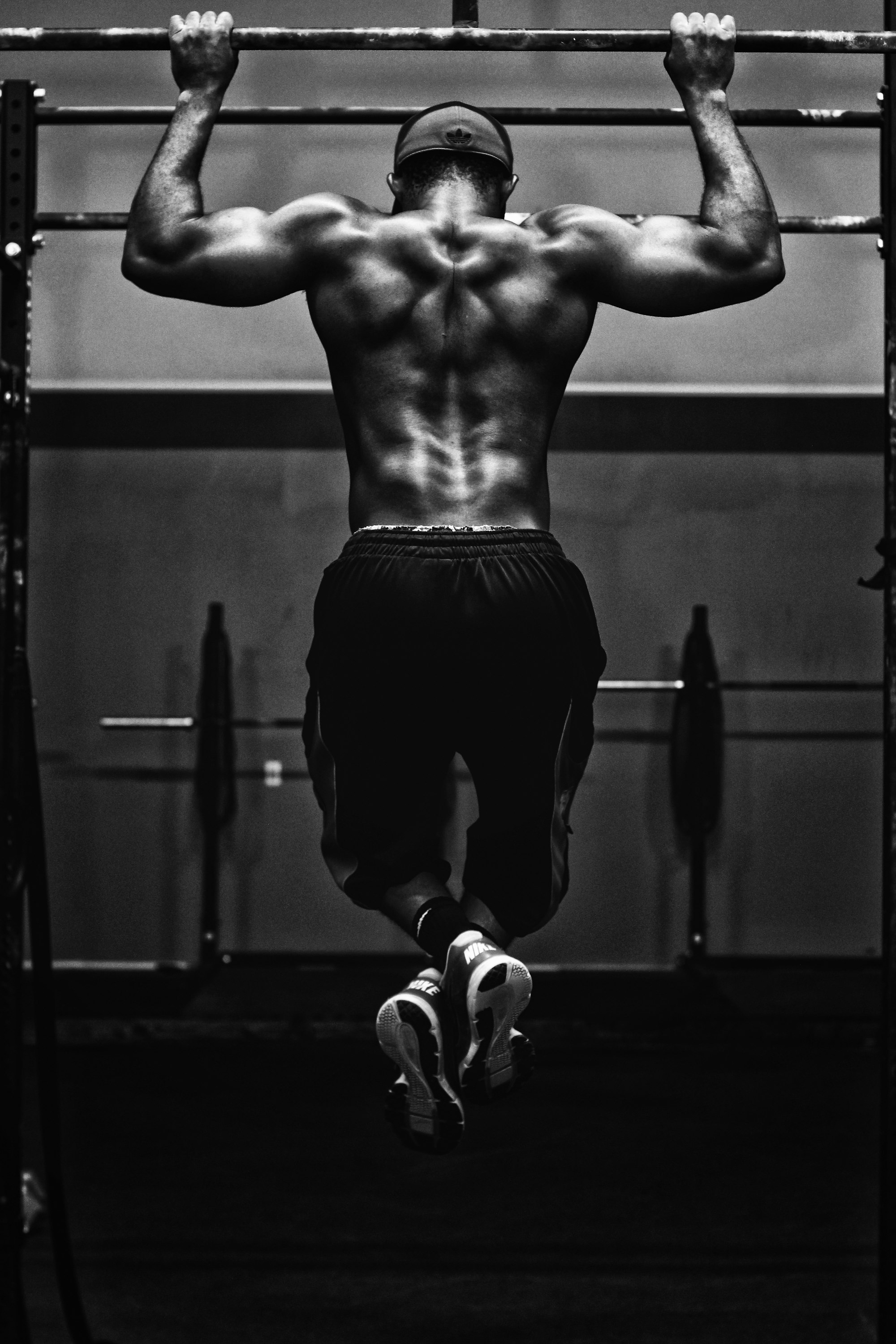 Athlete doing pull-ups on a rig